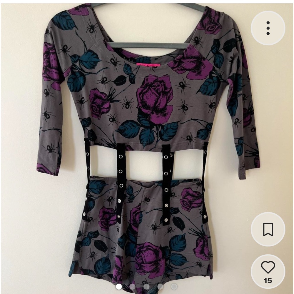 2010 ‘s spider jumpsuit with goth bondage type snap straps